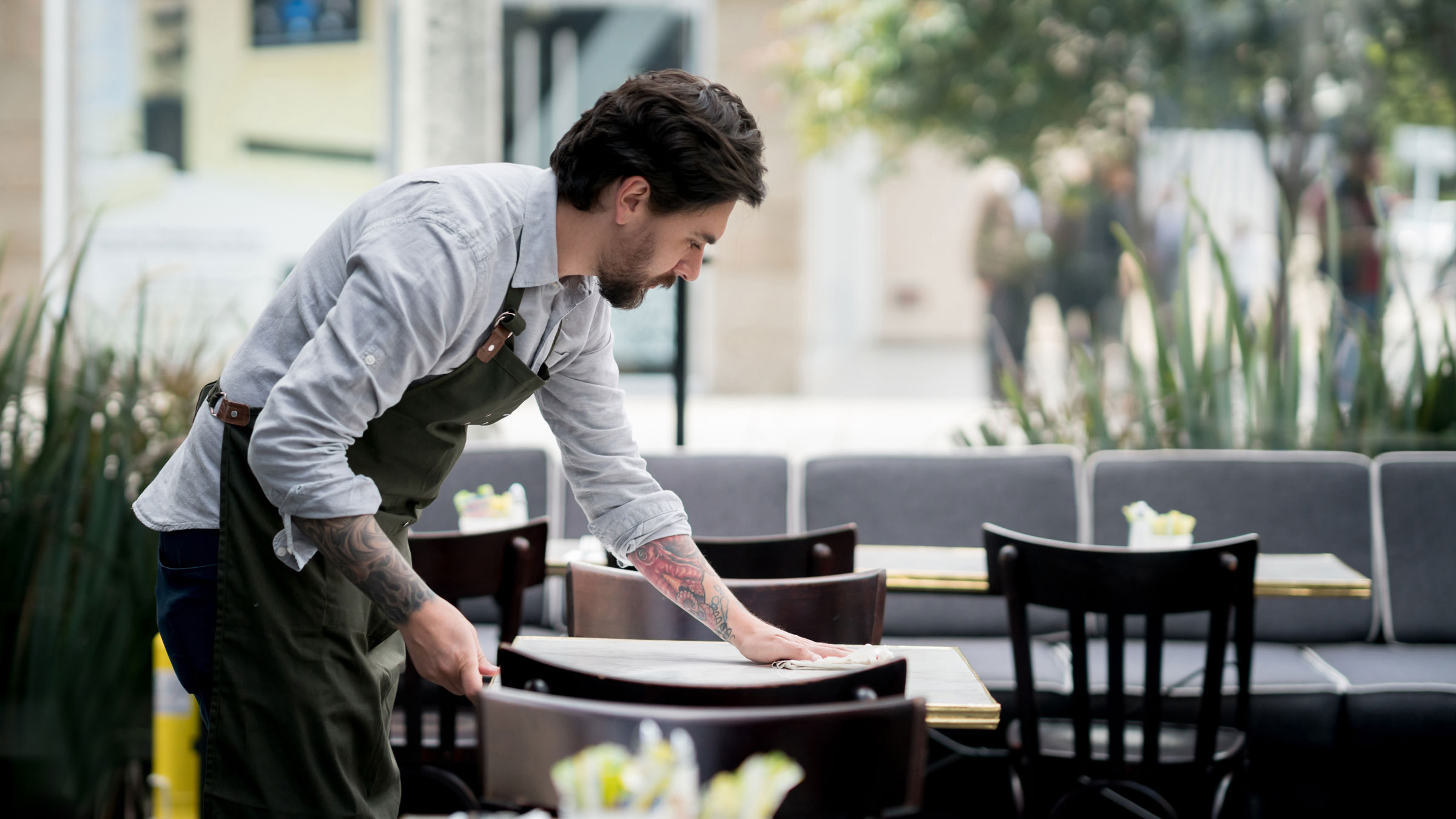 Server cleaning a table