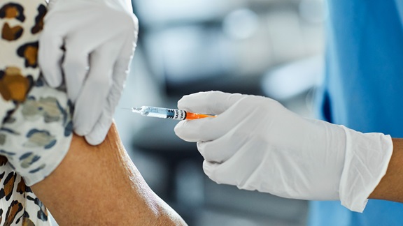 Adult getting a vaccine shot