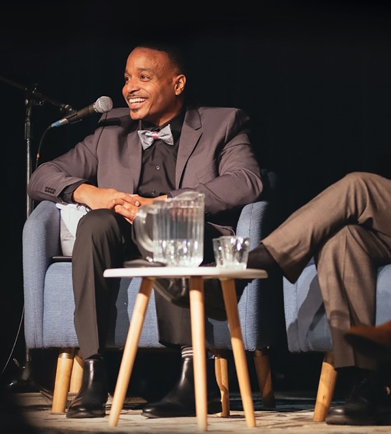 Rucker Johnson giving a presentation on stage