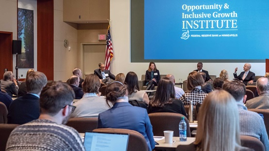 Photo of conference panel and audience