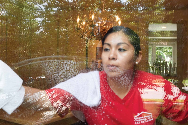Person cleaning a window