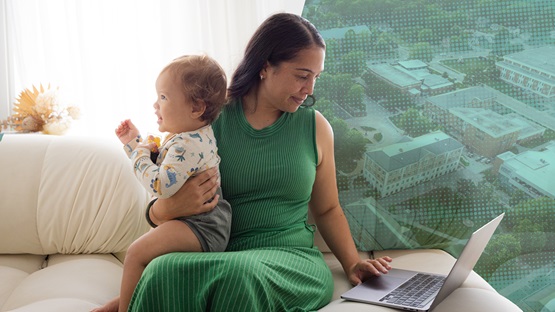 woman holding child, working on a laptop with an image of a college campus in the background