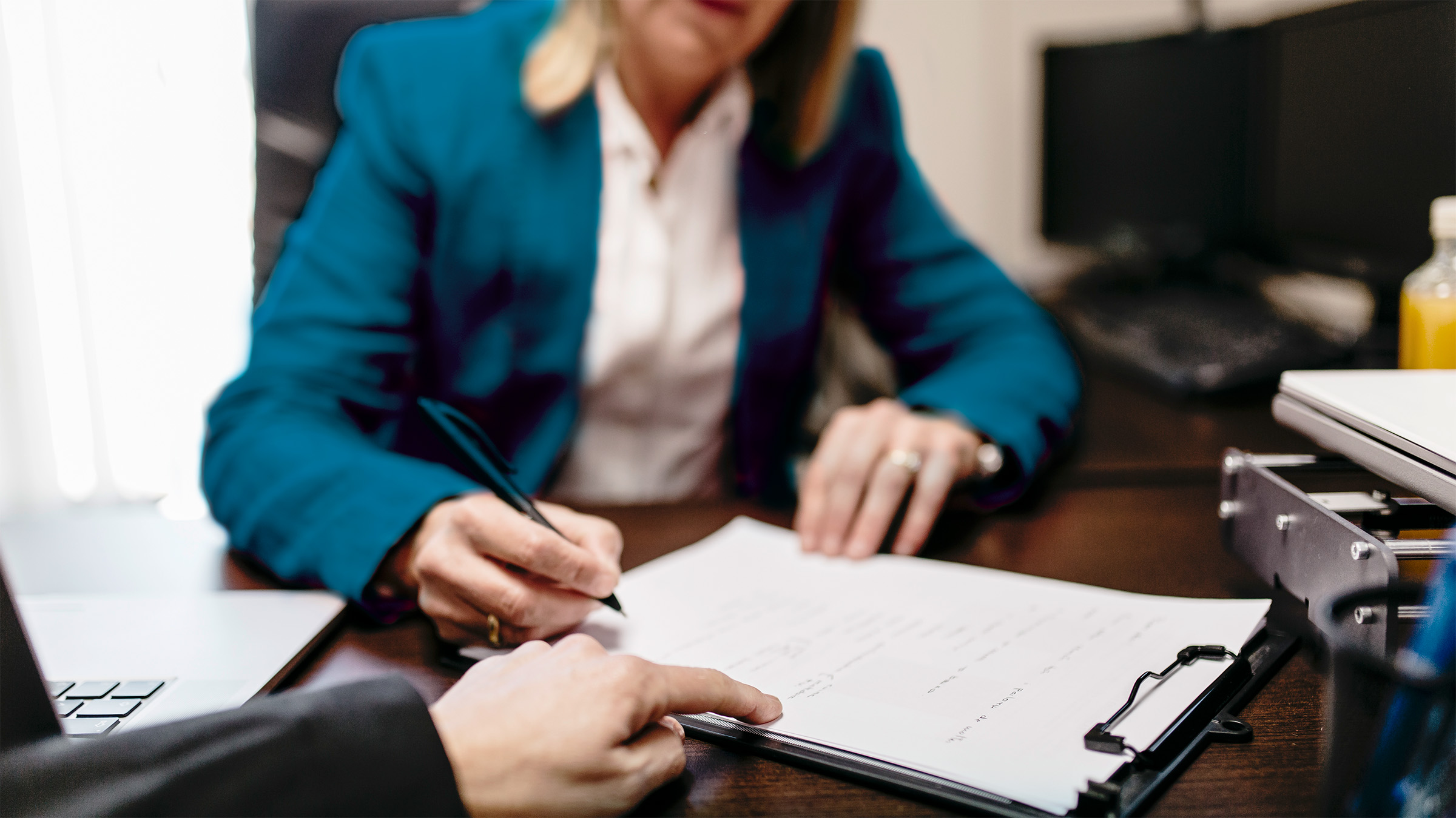 Professional services workers working at a desk