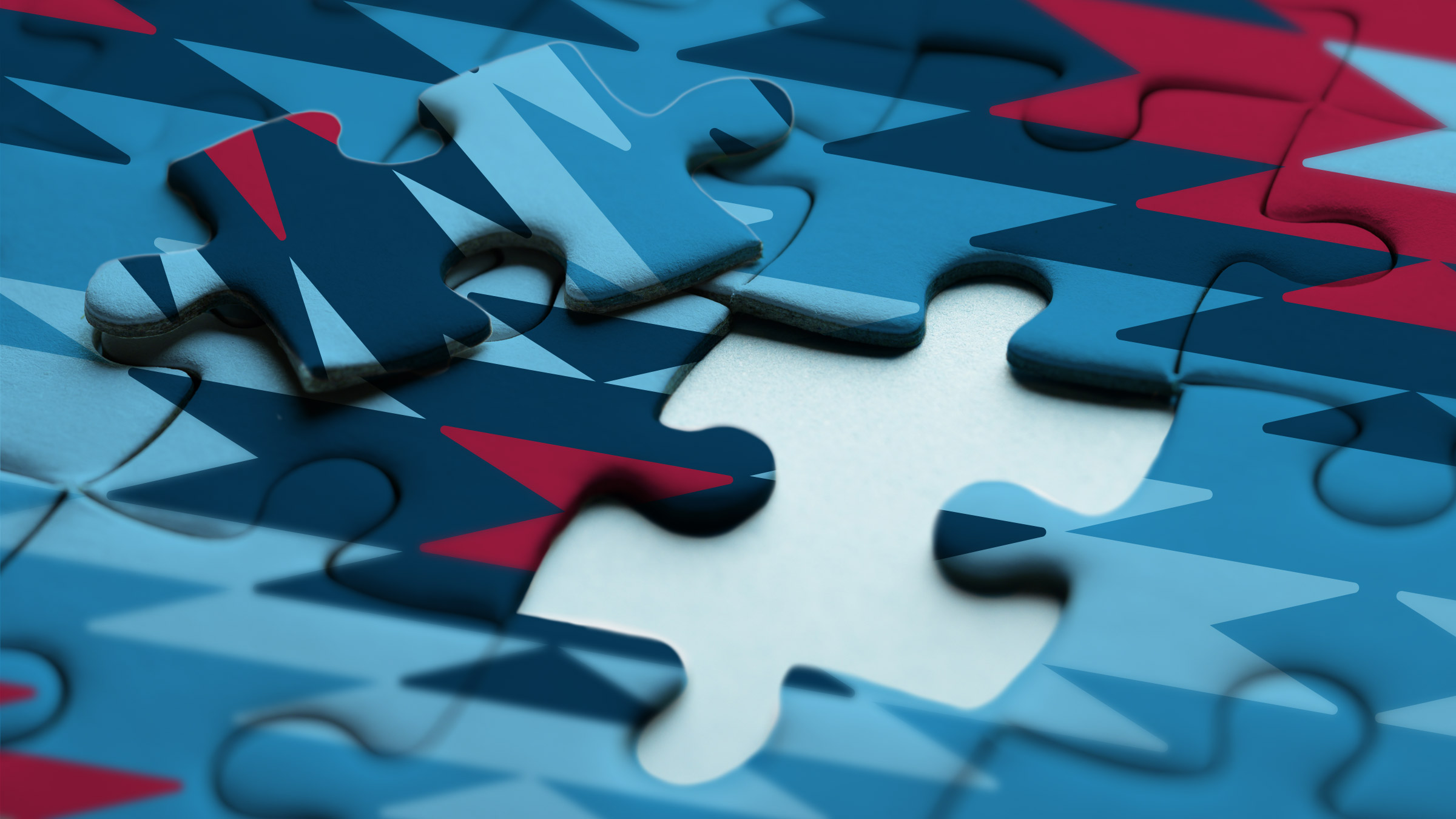 A puzzle with a tribal geometric design missing a piece