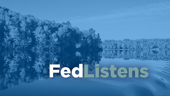 A peaceful and calm midwestern river with the words "FedListens" 