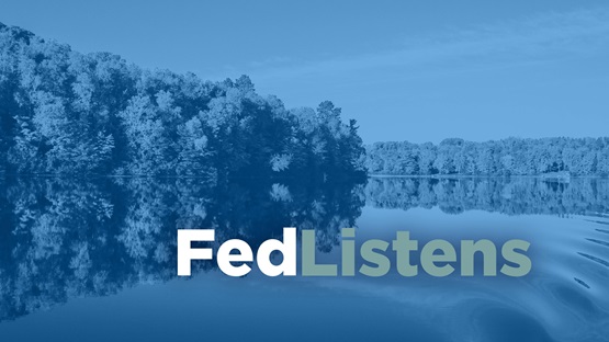 A peaceful and calm midwestern river with the words "FedListens" 