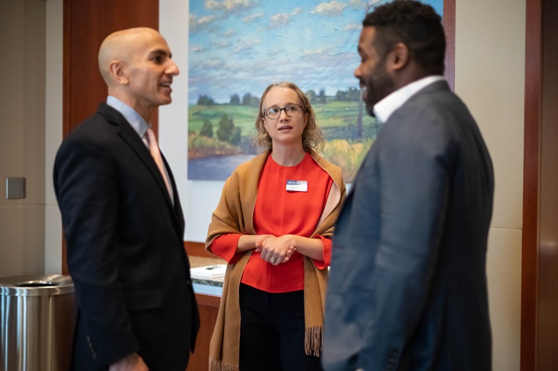 Three people talking together