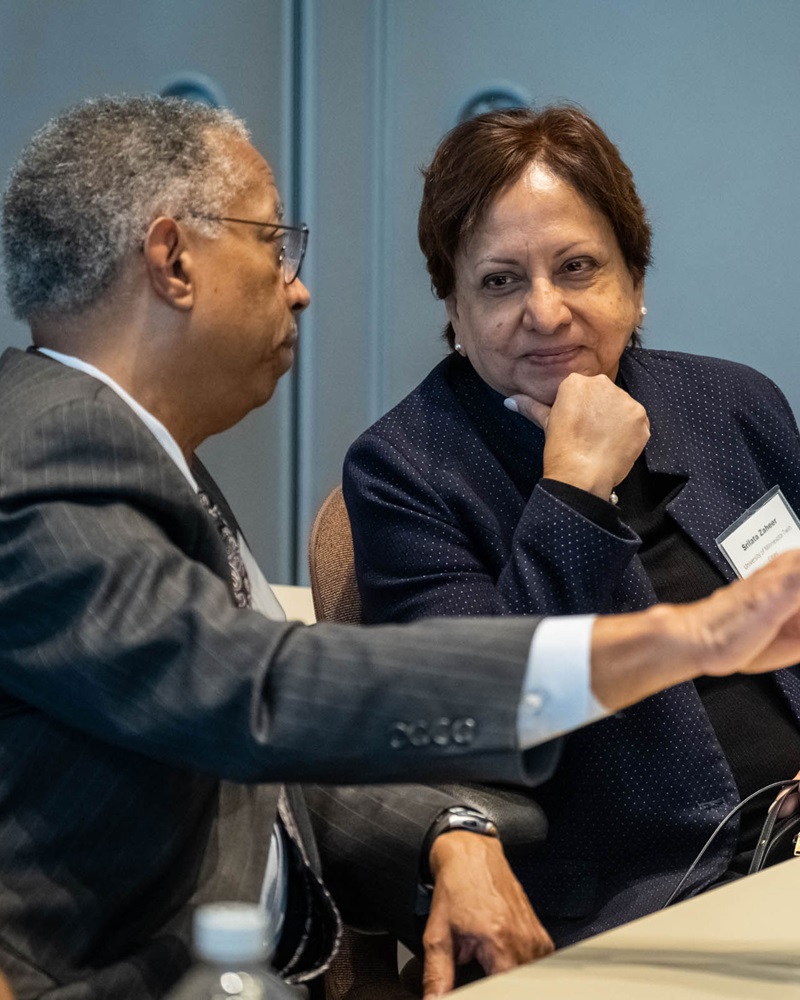 Two attendees talking