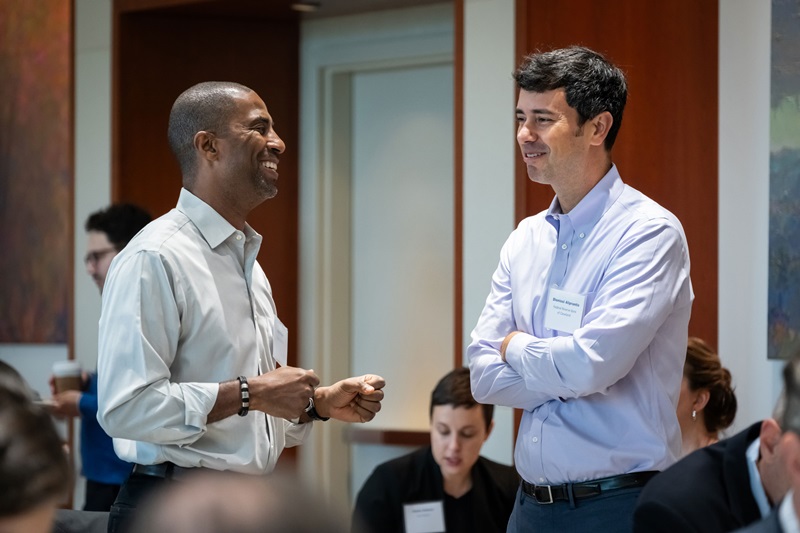Two people have a conversation at the conference