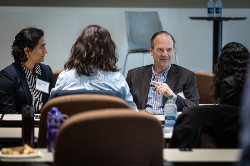 A group of people talking over lunch