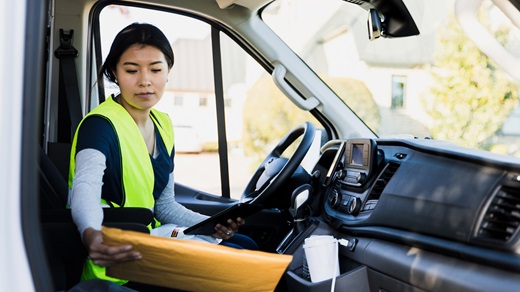 Female delivery driver in the vehicle