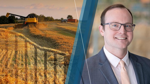 Image of harvesting wheat with a declining graph superimposed over the top beside a portrait of Joe Mahon