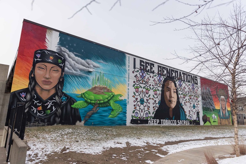 Photo of side of a building with painted murals