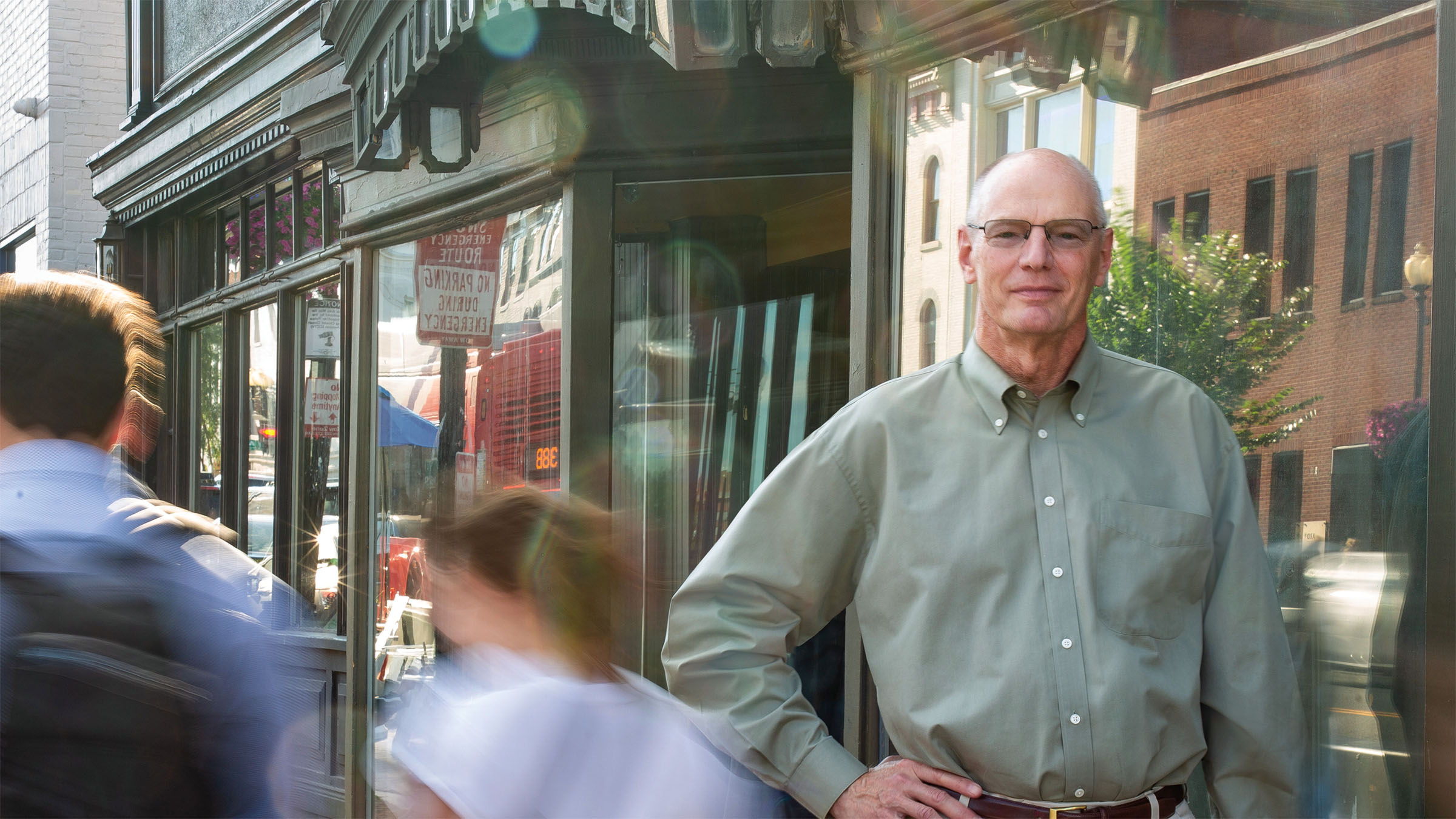 David Wilcox standing on a busy sidewalk