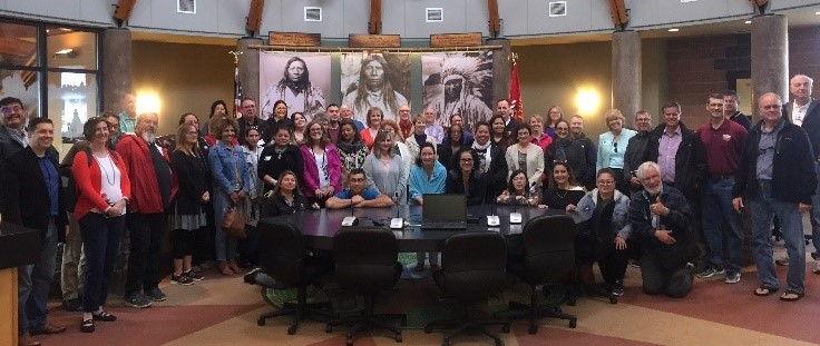 Group photo from the inaugural convening with Native American financial institutions (NAFIs)
