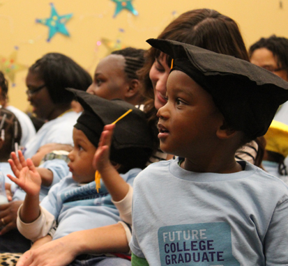 Young students and their parents attend a Northside Achievement Zone graduation event. (Photo courtesy of Northside Achievement Zone)