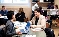 Volunteer tax preparers assist clients at Prepare + Prosper’s Volunteer Income Tax Assistance site at Hope Community Center in Minneapolis in 2013. Like other VITA