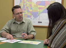 Jeff Matson, coordinator of the Community Geographic Information Systems program at the University of Minnesota's Center for Urban and Regional Affairs, meets with a representative from a client organization. (Photo by Chris Long)