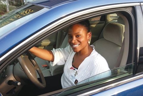 A happy car buyer prepares to drive off the lot in a vehicle she purchased through the Work-n-Wheels program, which provides zero-interest auto loans to qualified borrowers in southwestern Wisconsin. Photo by Jeff Segebrecht