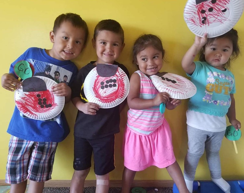 ECD in Indian Country, preschoolers displaying their art, 2 column