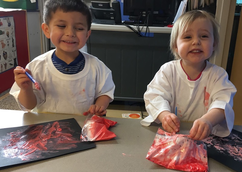 ECD in Indian Country, kids painting, 2 column