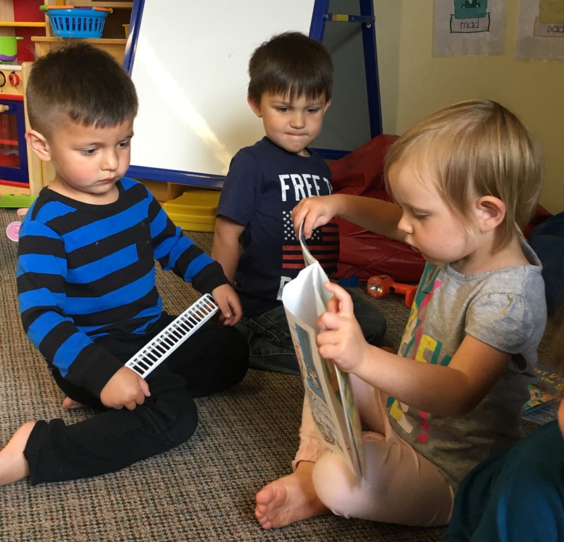 ECD in Indian Country, toddler reading, 2 column