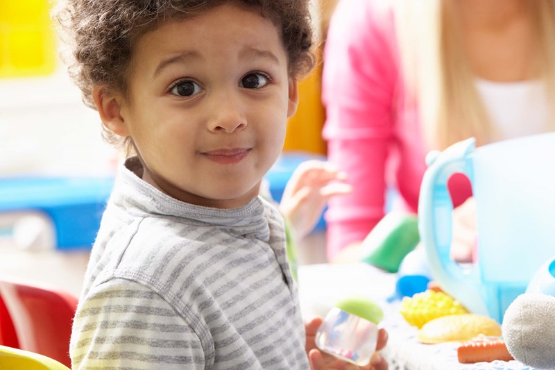 Pay for Success for ECD, close-up of preschool boy in classroom
