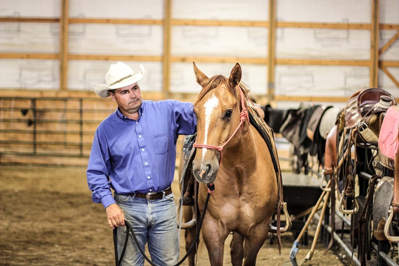 Zach Ducheneaux with horse, close-up