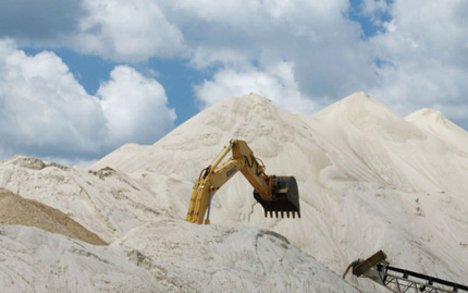 Large piles of frac sand at a Superior Silica Sands facility near New Auburn, Wis.
