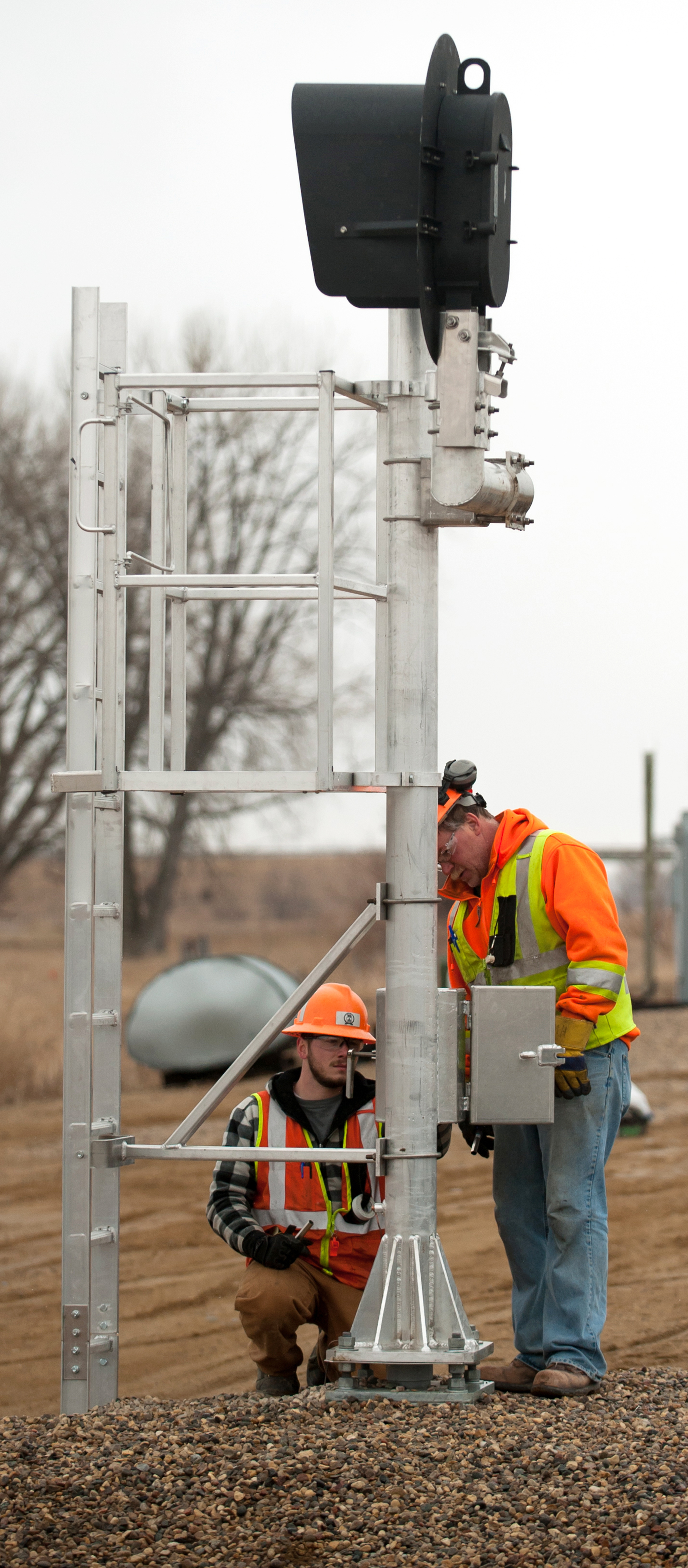 Workers installing CTC on a Canadian Pacific line in North Dakota.