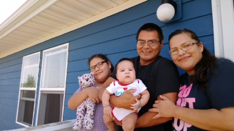 With the help of Lakota Funds, Kateri Edwards and Royce Gone bought their home last May. They’re joined here with their children, Summer and Royce, Jr.
