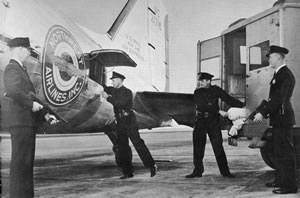 Photo: Loading cash onto a plane