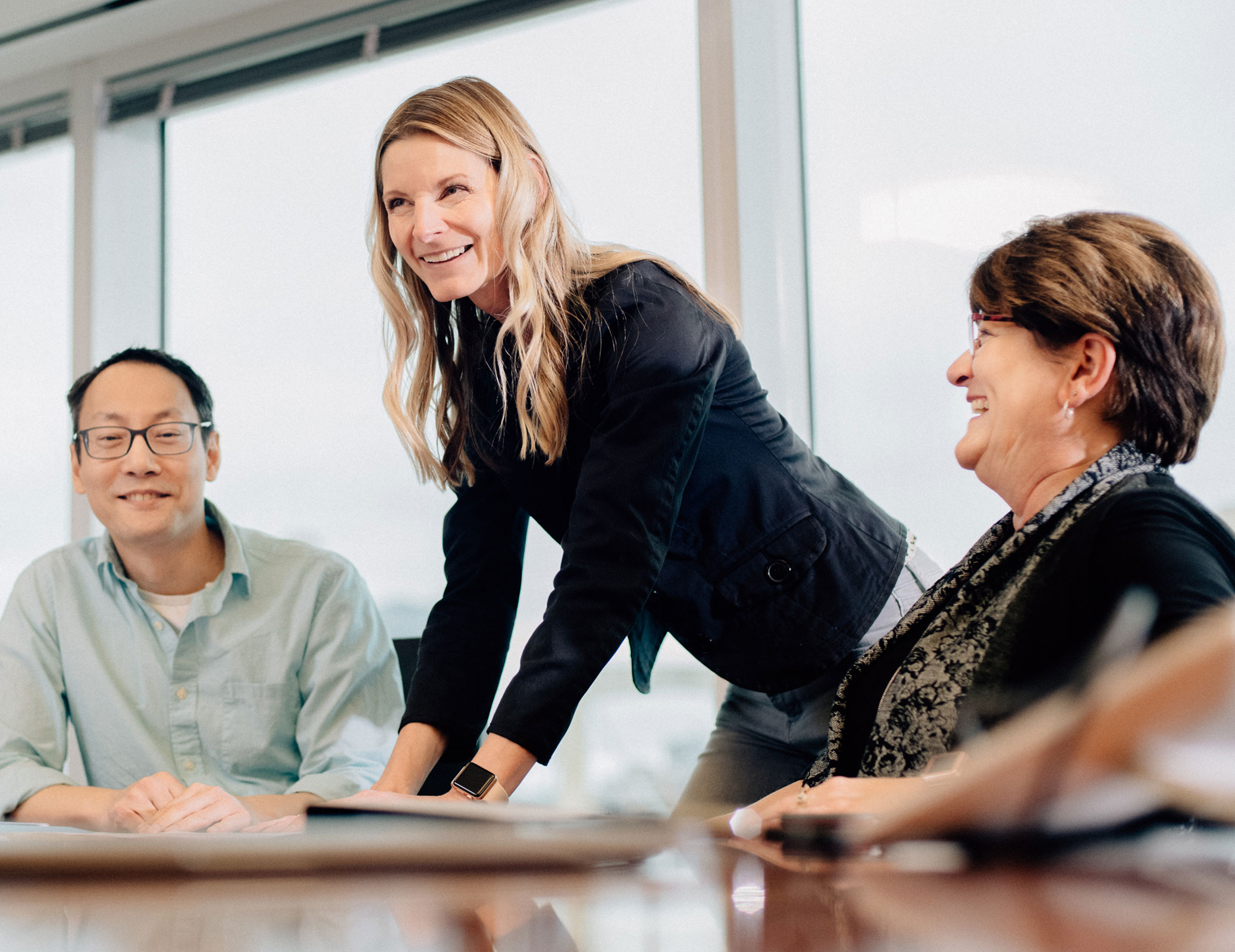 Minneapolis Fed employees collaborating in a meeting room