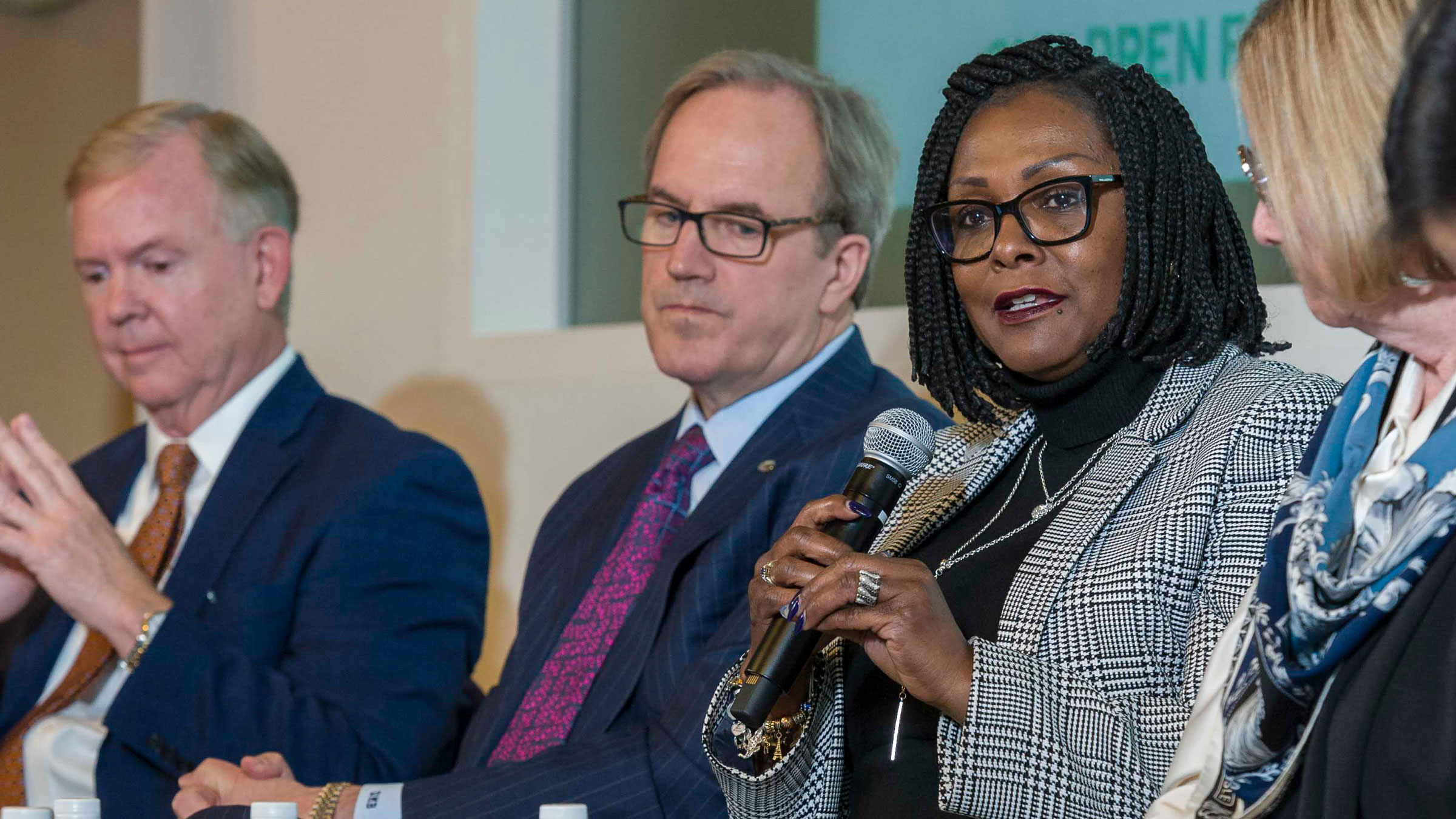 Minnesota Business Partnership’s Charlie Weaver and Ecolab’s Doug Baker listened as Rep. Rena Moran