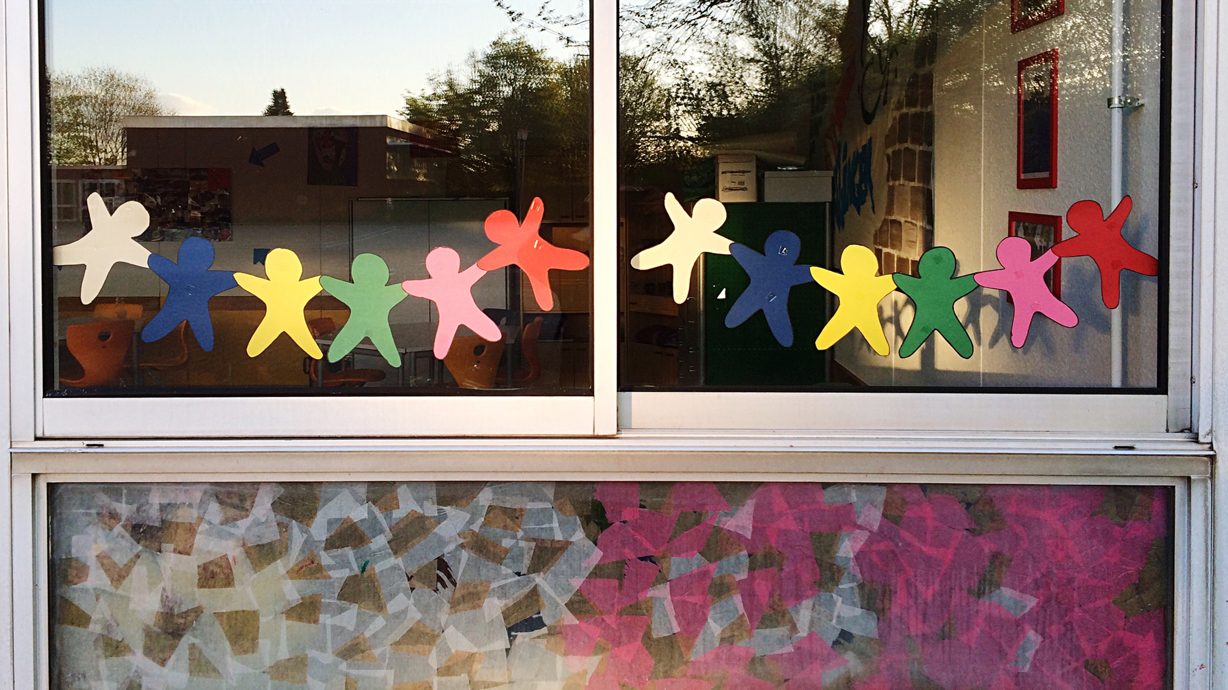 COVID-19 challenges the child care market, window with paper cutouts