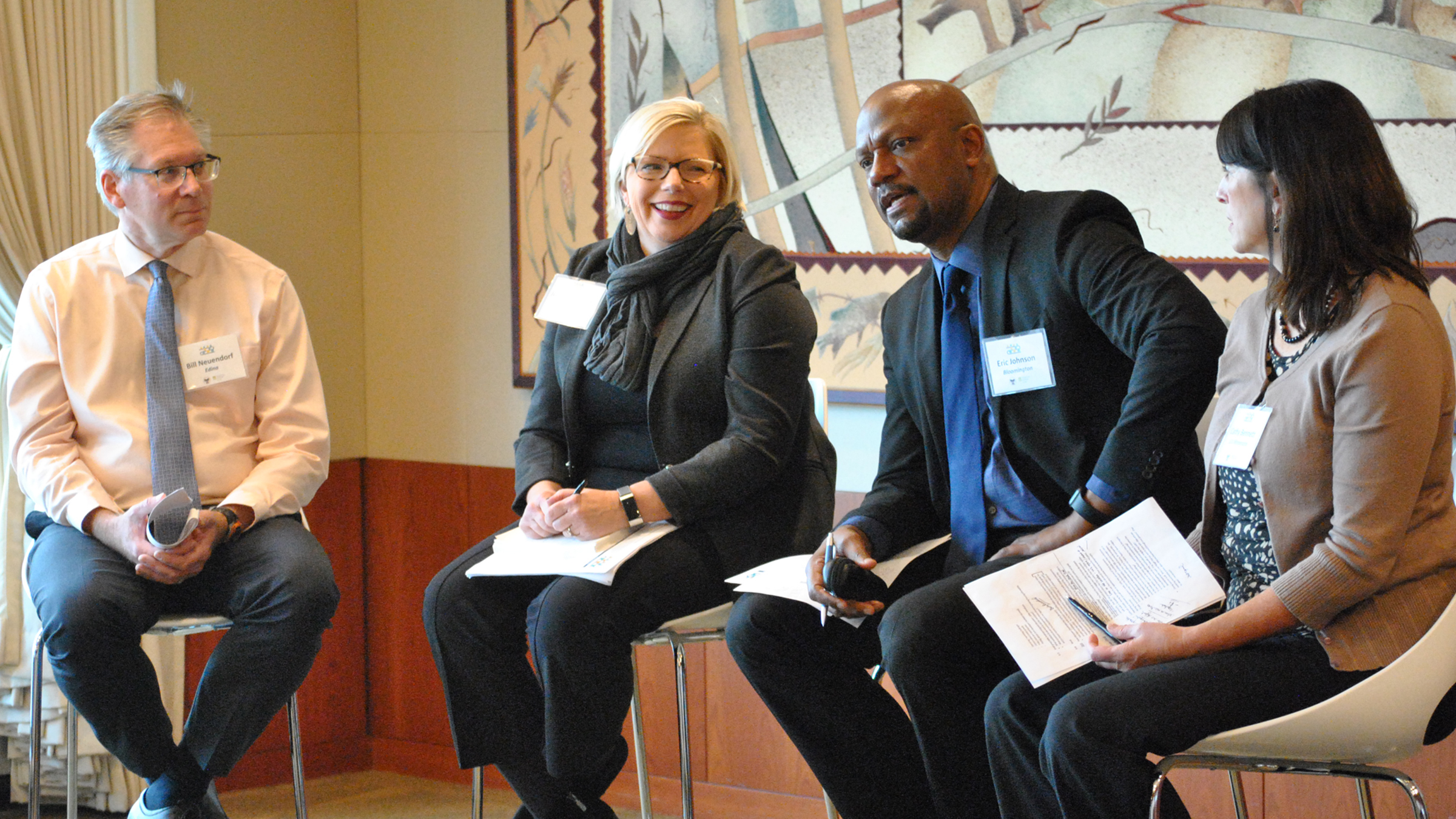 Panelists take questions at the October 30, 2019, peer learning exchange on mixed-income housing policies. From left to right: Bill Neuendorf, City of Edina; Julie Wischnack, City of Minnetonka; Eric Johnson, City of Bloomington; and moderator Cathy Capone Bennett, Urban Land Institute Minnesota.