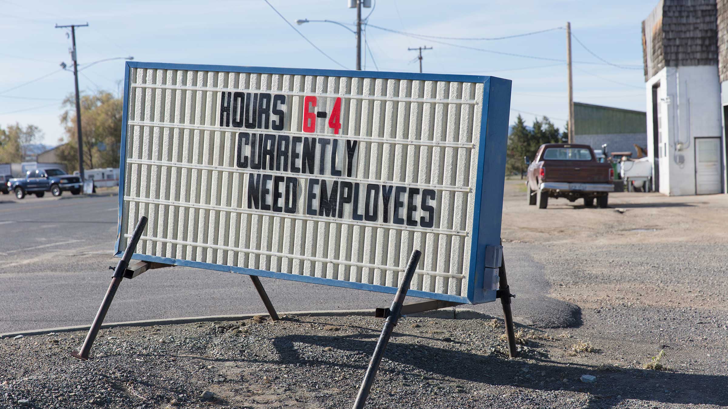 Photo of sign seeking employees