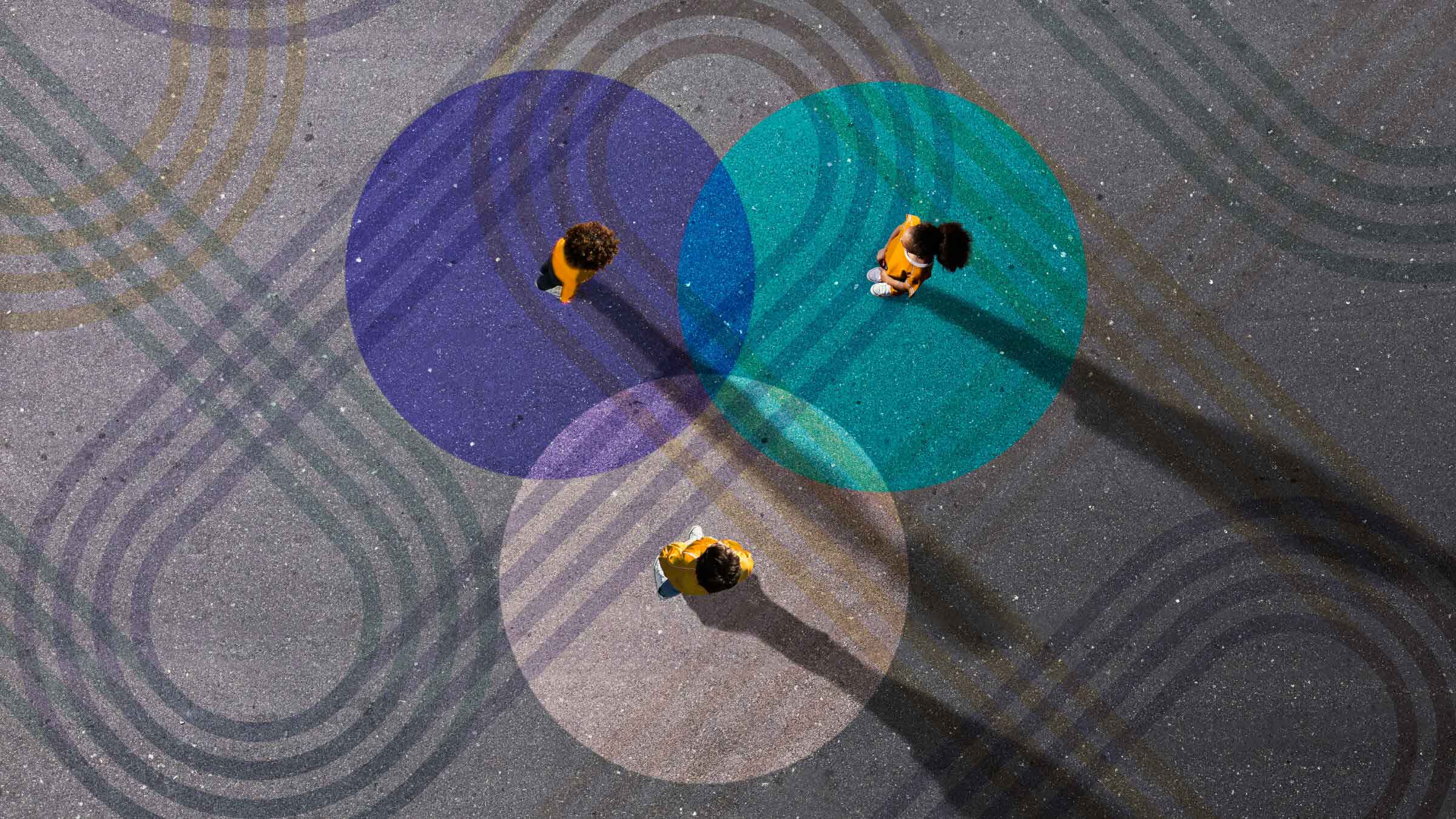 Bird's eye view of three people in overlapping circle graphics with geometric pattern all around