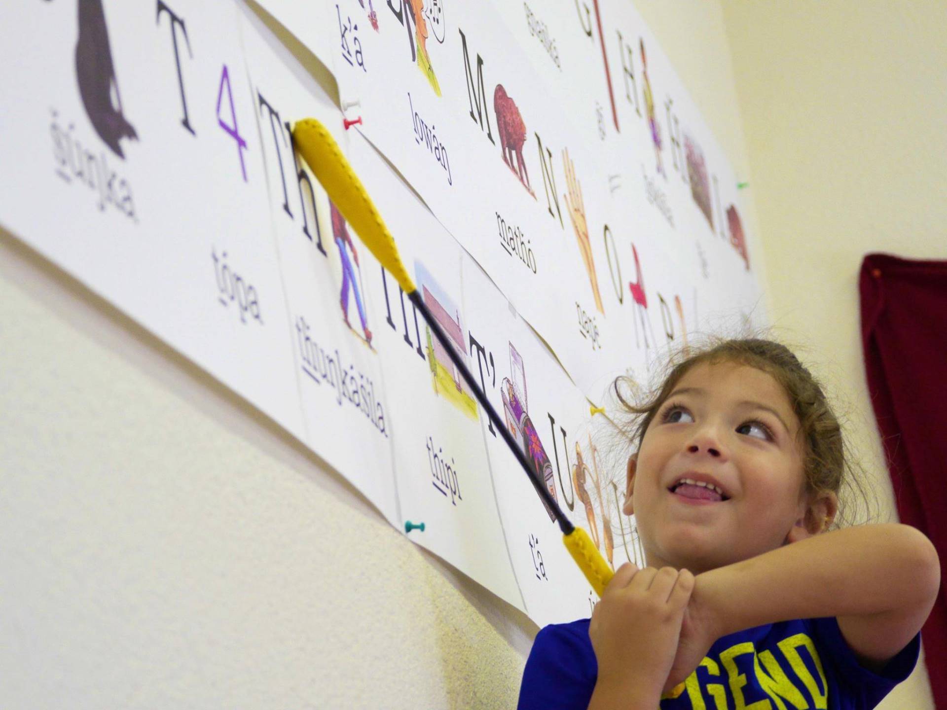 A child learns her letters at Lakota Immersion Childcare